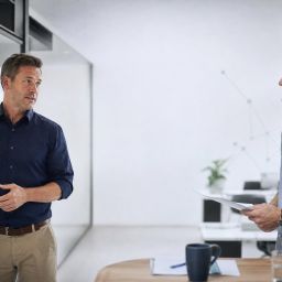 Business owners mapping a practical service workflow in a modern office