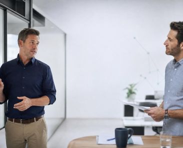 Business owners mapping a practical service workflow in a modern office